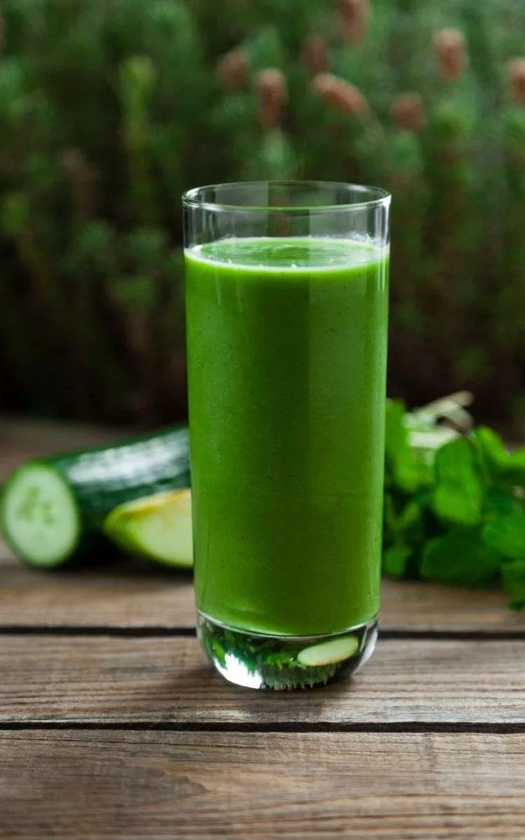 Glass of green juice representing an obsession with healthy foods.