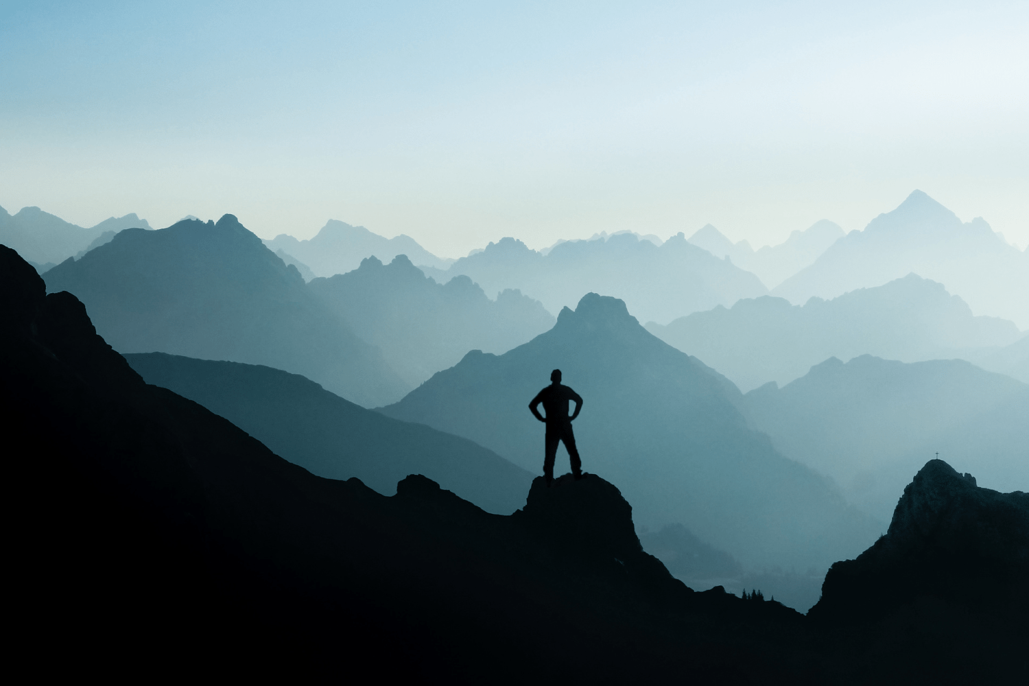 Man climbing a mountain, symbolizing how recovery is not linear.