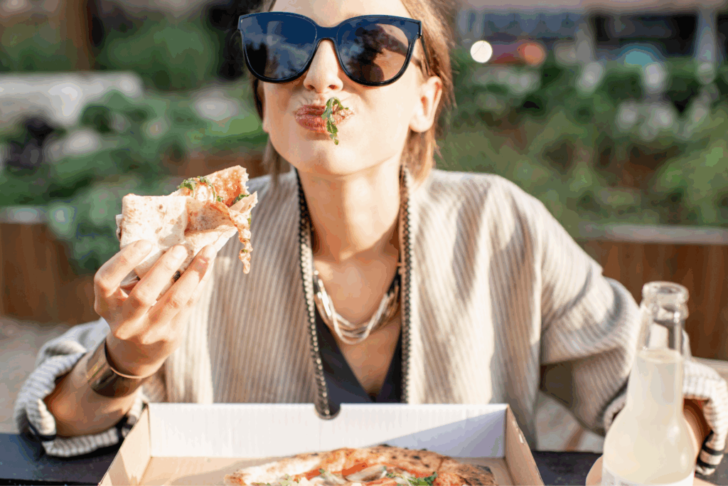 Tune Into Your Body to Improve Your Relationship with Food - Woman Eating Pizza