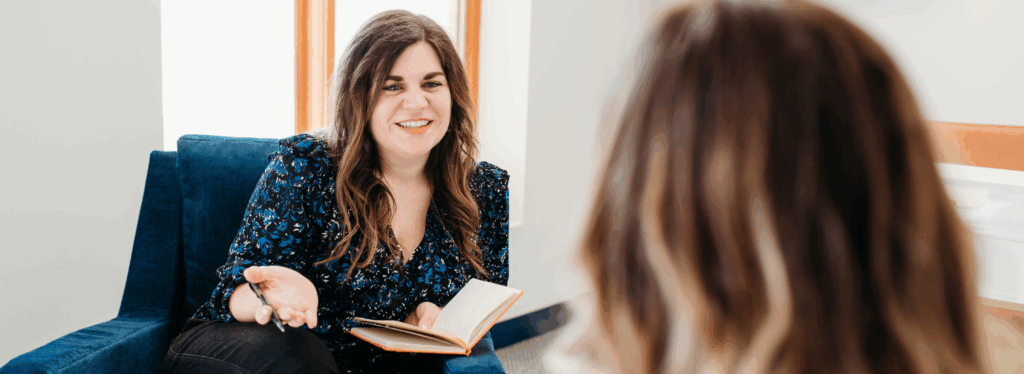 Registered Dietitian at her job, happily counseling a patient