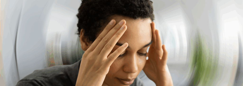 Woman feeling dizzy due to Postural Orthostatic Tachycardia Syndrome (POTS)