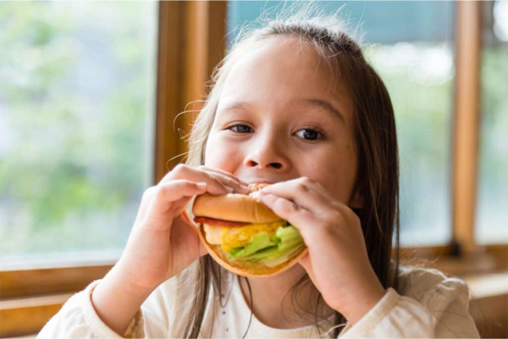 Child Eating a Sandwich