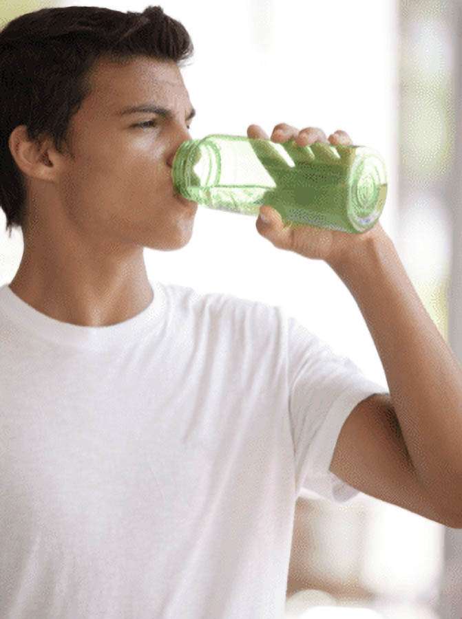 Hydration for Athlete Recovery - Teen Drinking Water