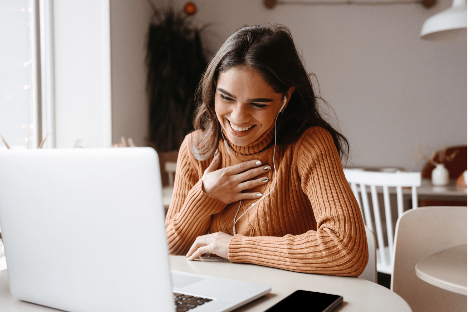 Virtual and Telehealth Eating Disorder Dietitian - Woman Smiling at Computer