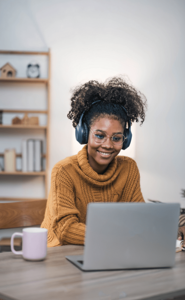 Smiling woman on laptop during a telehealth nutrition session