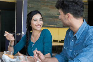 Friend offering meal time support