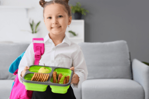 Girl ready for school with her lunch
